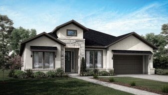 view of front of property with a garage and a front lawn