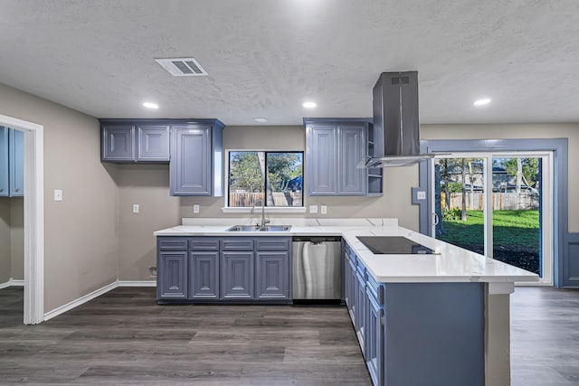 kitchen with dishwasher, sink, plenty of natural light, extractor fan, and a textured ceiling