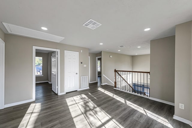 spare room featuring dark wood-type flooring