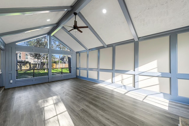 unfurnished sunroom featuring vaulted ceiling with beams and ceiling fan