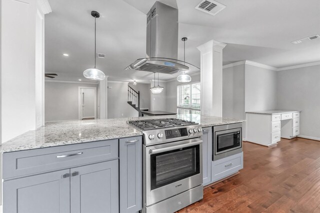 kitchen with island exhaust hood, gray cabinets, appliances with stainless steel finishes, kitchen peninsula, and dark hardwood / wood-style flooring