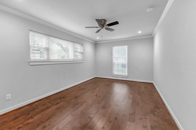 unfurnished room featuring ornamental molding, ceiling fan, hardwood / wood-style flooring, and a healthy amount of sunlight