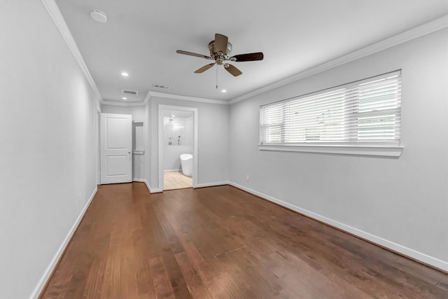 unfurnished bedroom featuring ensuite bathroom, dark hardwood / wood-style flooring, ceiling fan, and ornamental molding