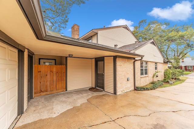 view of side of property with a carport