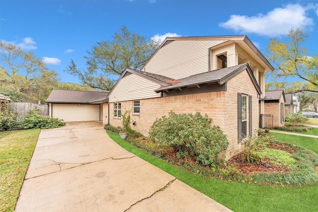 view of front of house featuring a garage and a front lawn