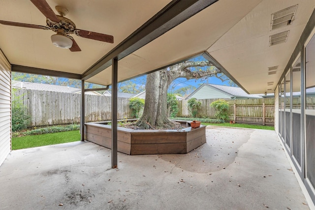 view of patio featuring a fenced backyard, ceiling fan, and visible vents