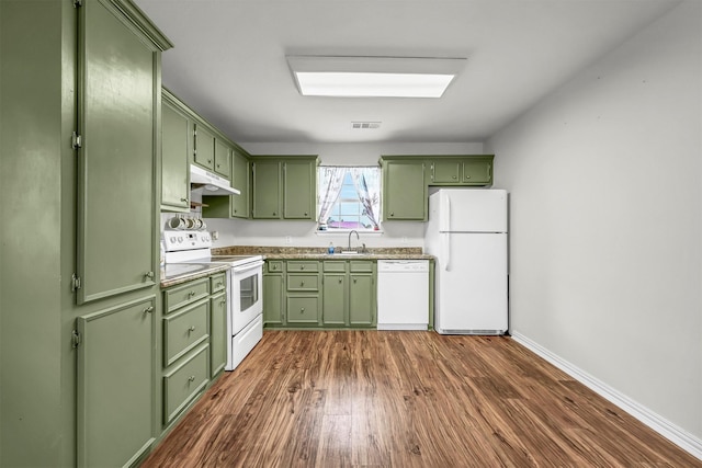 kitchen with dark hardwood / wood-style flooring, white appliances, sink, and green cabinetry