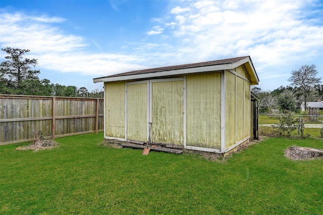 view of outbuilding with a lawn