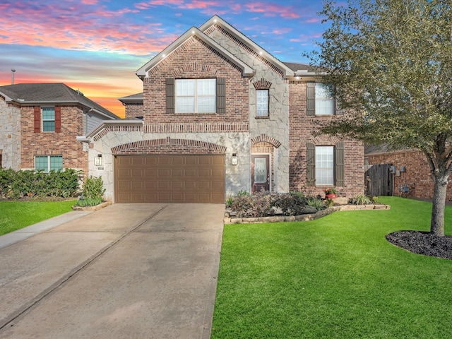 view of front property with a garage and a yard