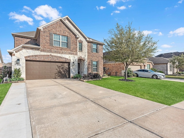 view of front of home with a garage and a front yard