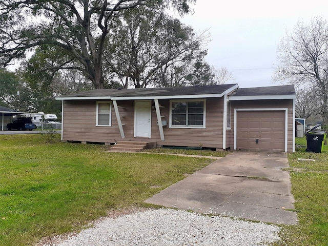 single story home featuring a front lawn and a garage