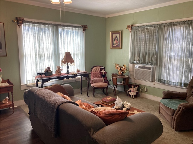 living room with hardwood / wood-style floors, cooling unit, ornamental molding, and a wealth of natural light