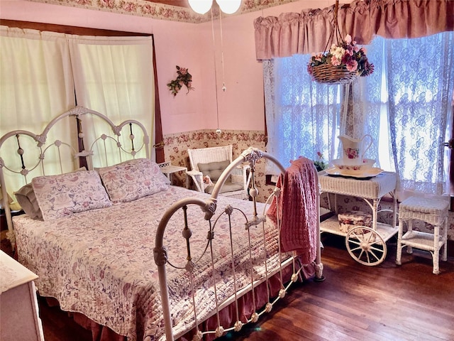 bedroom featuring dark hardwood / wood-style flooring