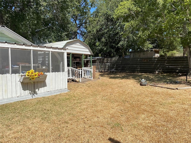 view of yard featuring a sunroom