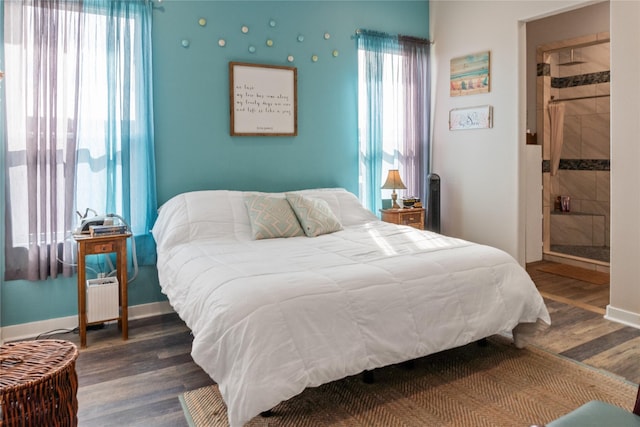 bedroom with dark hardwood / wood-style floors