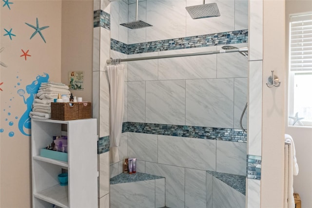 bathroom with a tile shower