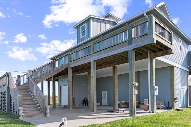 back of house with a patio area and a deck