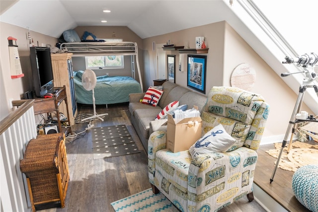 bedroom featuring vaulted ceiling with skylight and wood-type flooring