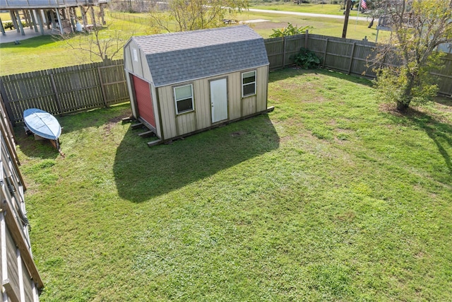 view of outbuilding with a lawn