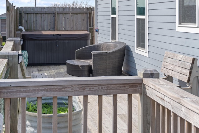 deck with a hot tub