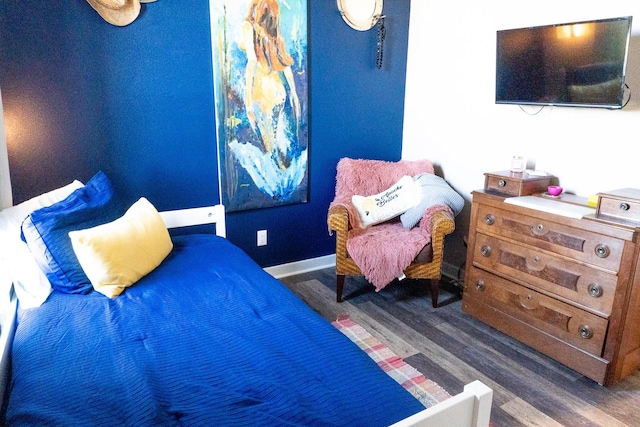 bedroom featuring dark hardwood / wood-style flooring