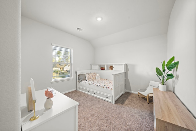 carpeted bedroom with lofted ceiling