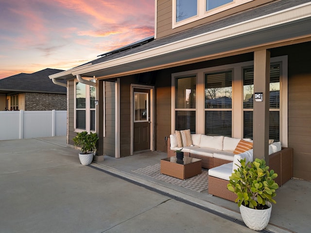 patio terrace at dusk with outdoor lounge area