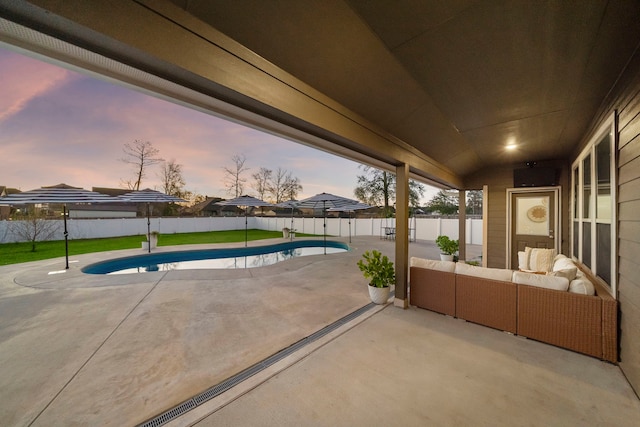 exterior space with a fenced in pool, an outdoor living space, and a lawn