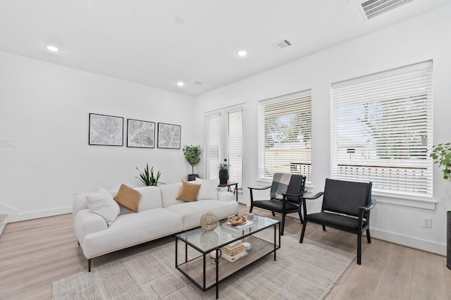 living room with light hardwood / wood-style floors