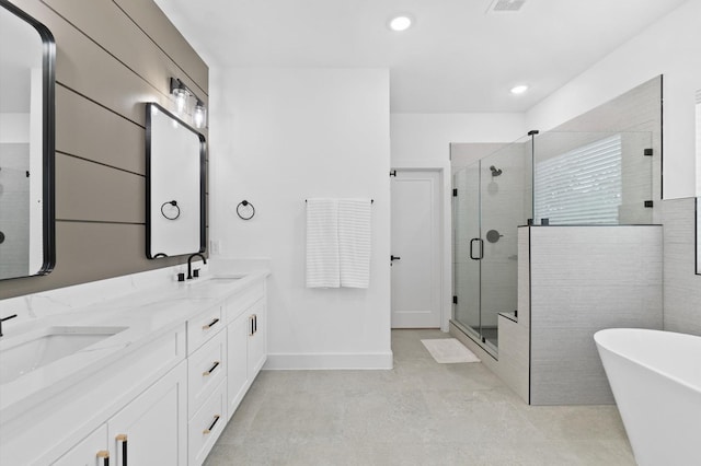 bathroom featuring vanity and shower with separate bathtub