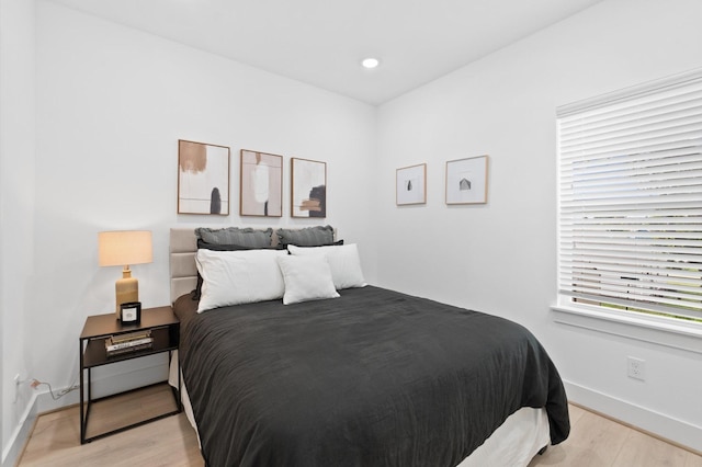 bedroom with light hardwood / wood-style floors