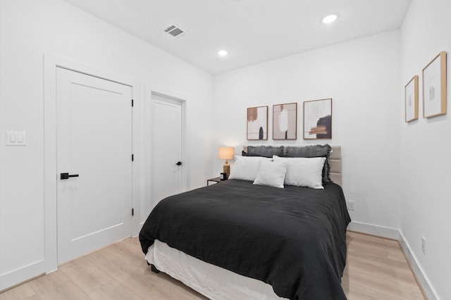 bedroom with light hardwood / wood-style flooring