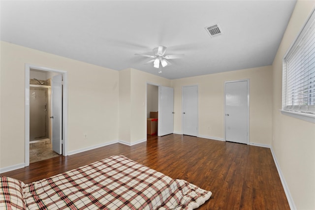 unfurnished bedroom featuring ceiling fan and dark hardwood / wood-style floors