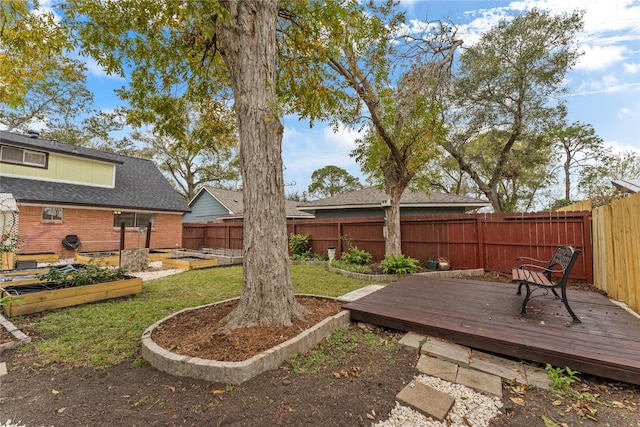 view of yard with a wooden deck