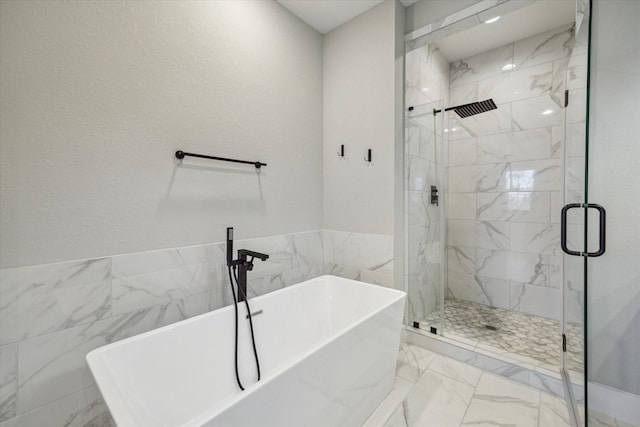 bathroom with plus walk in shower and tile walls