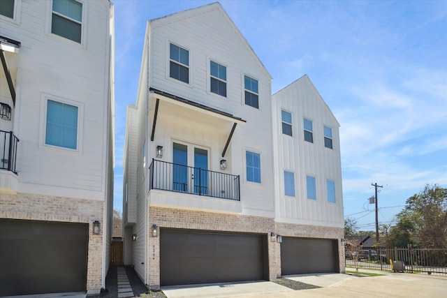 multi unit property with a balcony and a garage