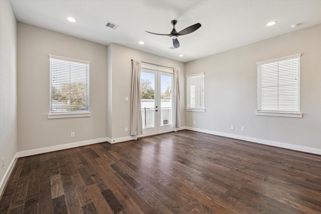 empty room featuring french doors, dark hardwood / wood-style floors, and plenty of natural light