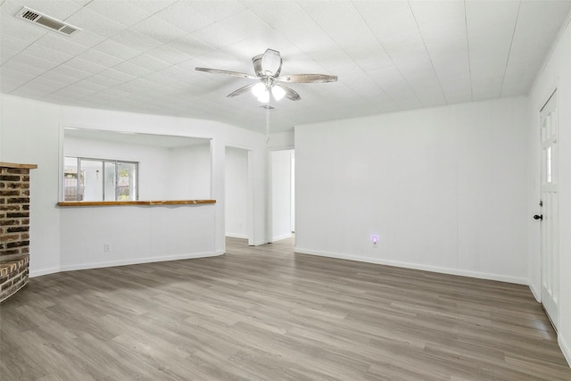 unfurnished living room with ceiling fan and hardwood / wood-style floors