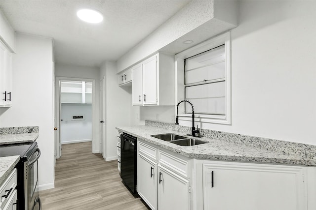 kitchen featuring white cabinetry, sink, light stone countertops, and black dishwasher