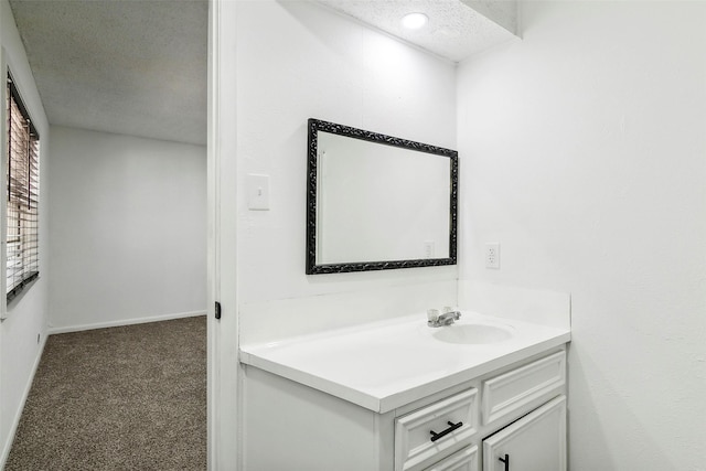 bathroom with vanity and a textured ceiling