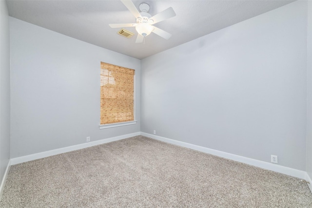 empty room featuring carpet flooring and ceiling fan