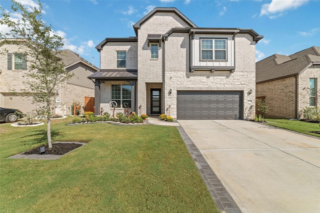 view of front of home with a front yard and a garage