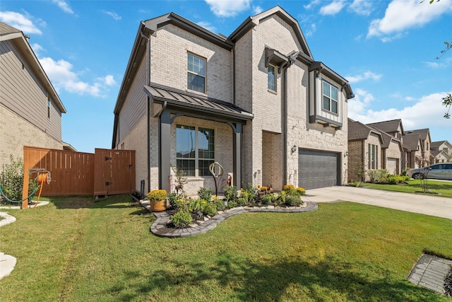 view of front of property featuring a front lawn and a garage