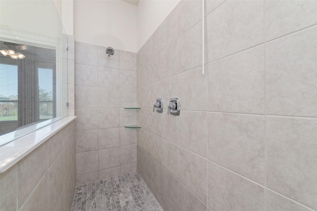 bathroom with tiled shower