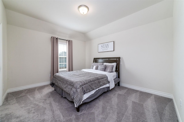 carpeted bedroom featuring vaulted ceiling