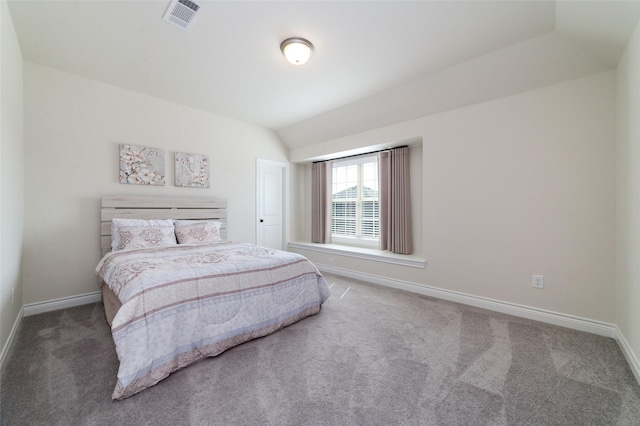 carpeted bedroom featuring vaulted ceiling