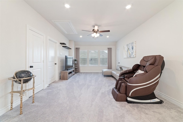 living room with ceiling fan and light colored carpet