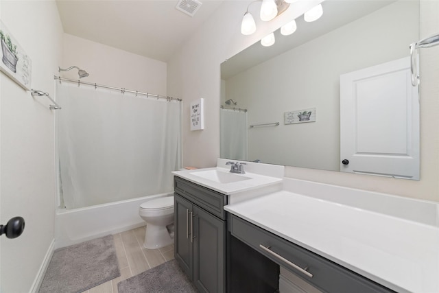 full bathroom with shower / bathtub combination with curtain, vanity, and toilet