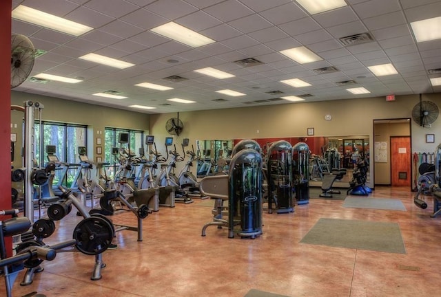 exercise room featuring a paneled ceiling