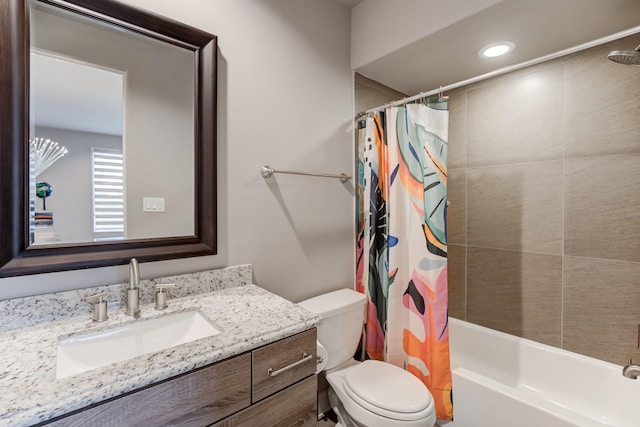 full bathroom featuring vanity, toilet, and shower / bath combo